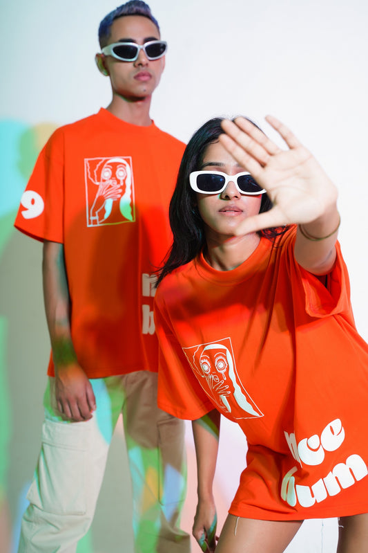 Graphic over size t-shirt in orange color.